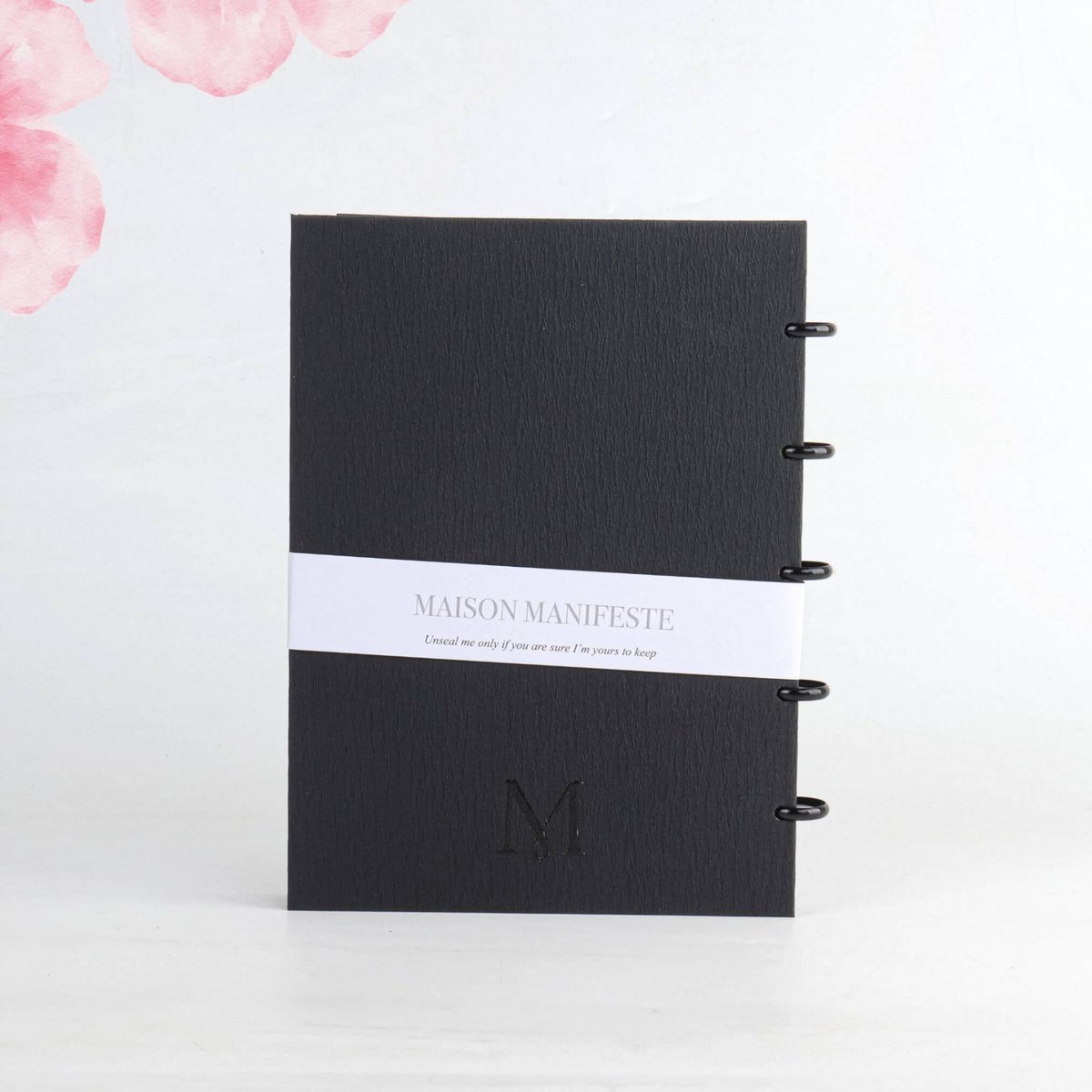 Back cover of the Black A4 (8.27 x 11.69 in) discbound notebook: belly band, embossed 'M' monogram