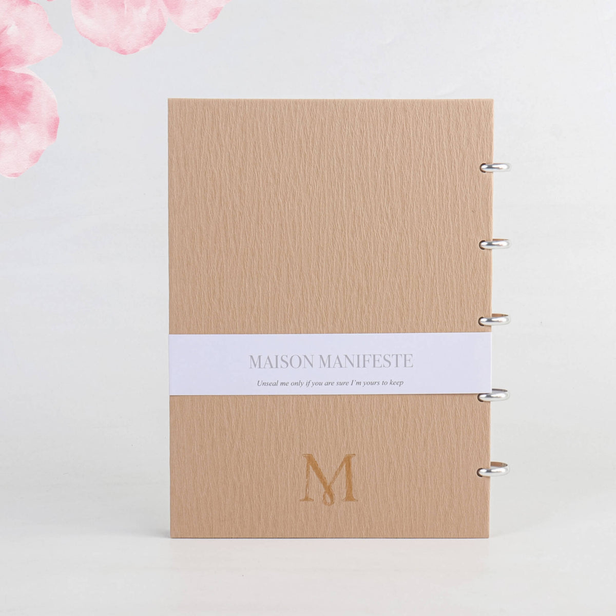 Back cover of the Chai A4 (8.27 x 11.69 in) discbound notebook: belly band, embossed 'M' monogram, camel tan
