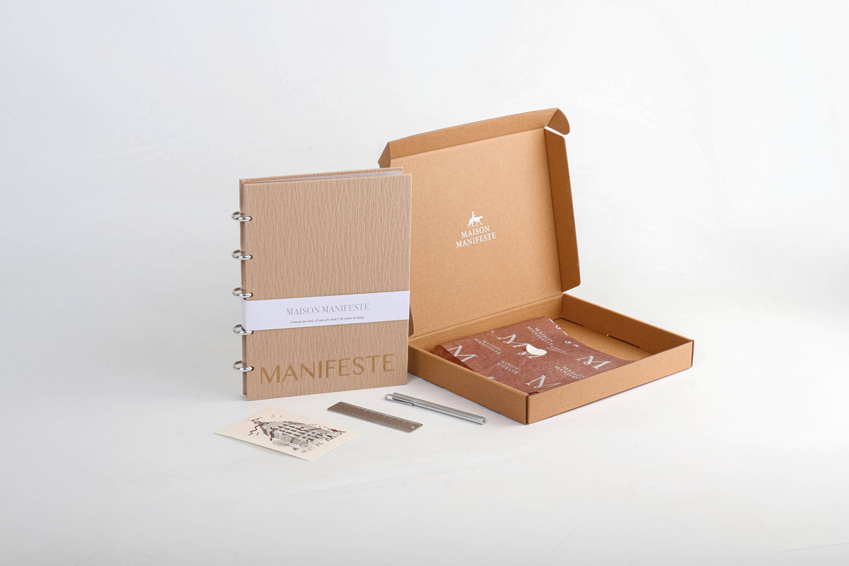 Chai A4 (8.27 x 11.69 in) discbound notebook executive gift set beside its open kraft packaging